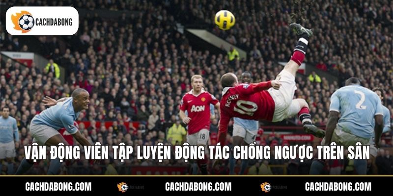 Vận động viên tập luyện động tác chổng ngược trên sân